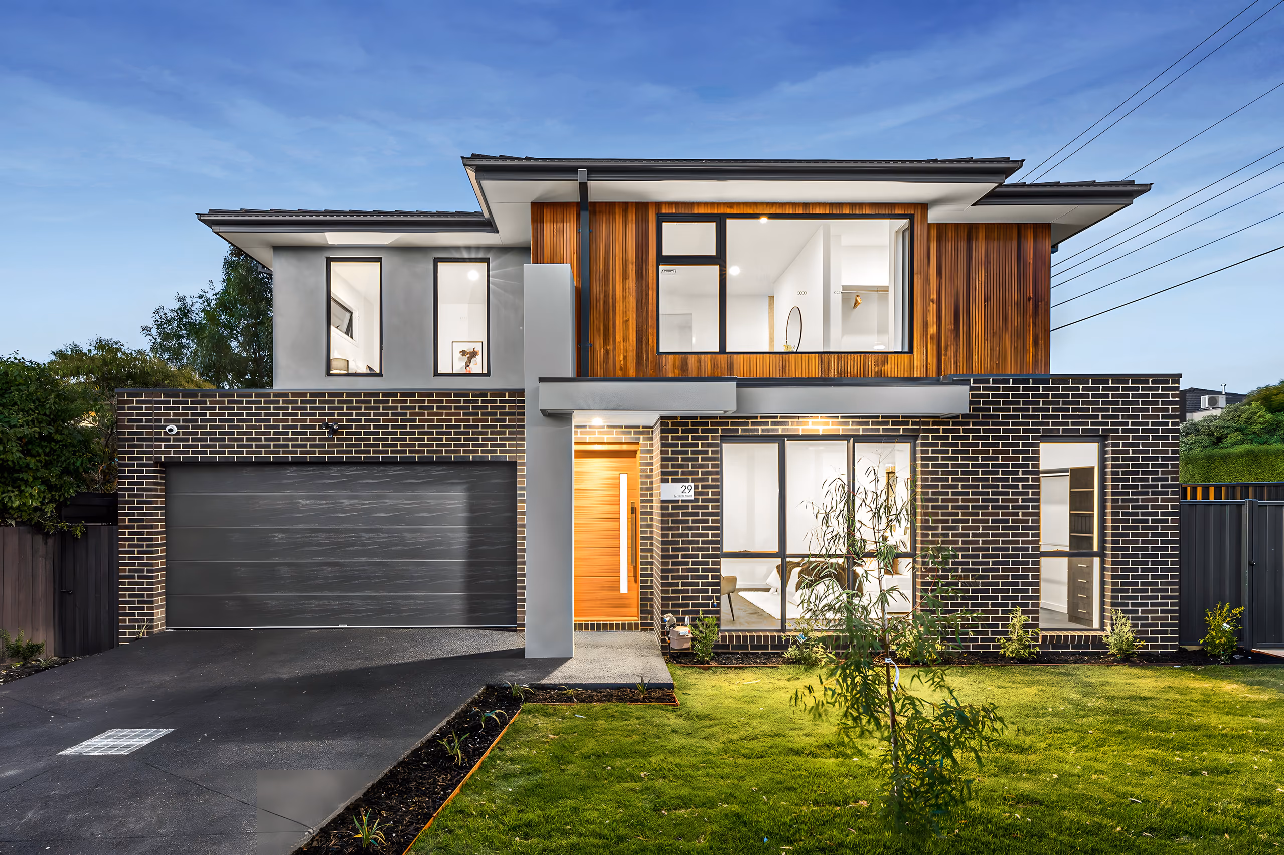 Summit Road townhouse with a timber-clad upper storey over brick